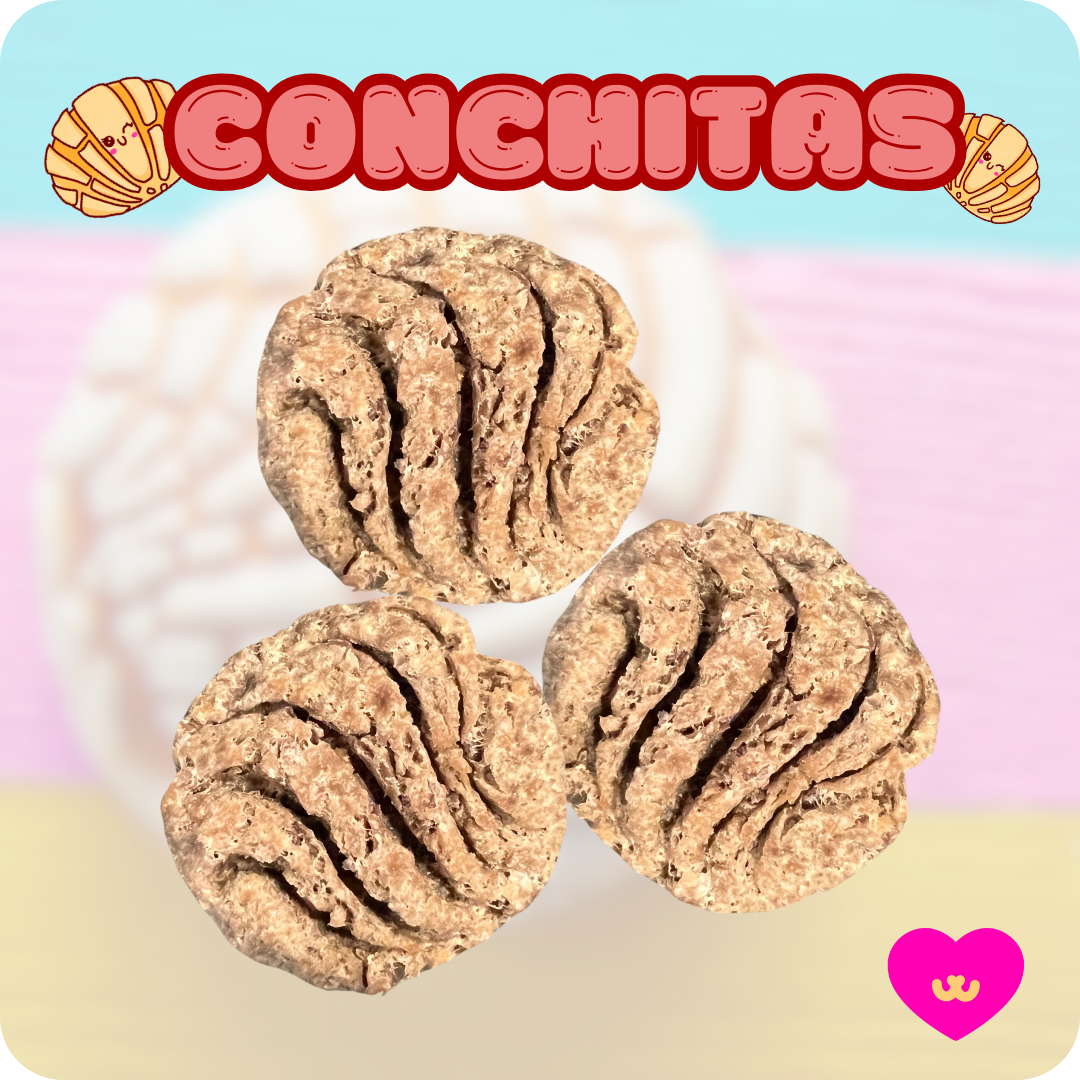 Close-up of Owa Owa Conchitas treats shaped like traditional Mexican conchas on a soft pink background.