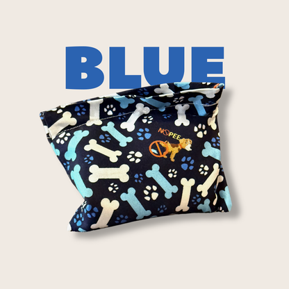 Close-up of blue NOPEE dog urine marking deterrent bag with bone and paw print design