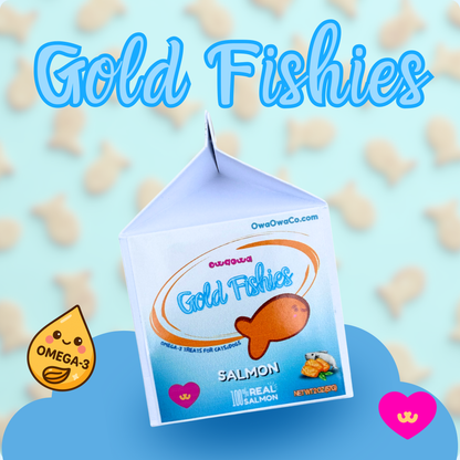 Owa Owa Gold Fishies carton on teal background with scattered goldfish-shaped treats. Made with wild sockeye salmon, eggs, eggshell membrane, turmeric, and black pepper for dogs and cats. 